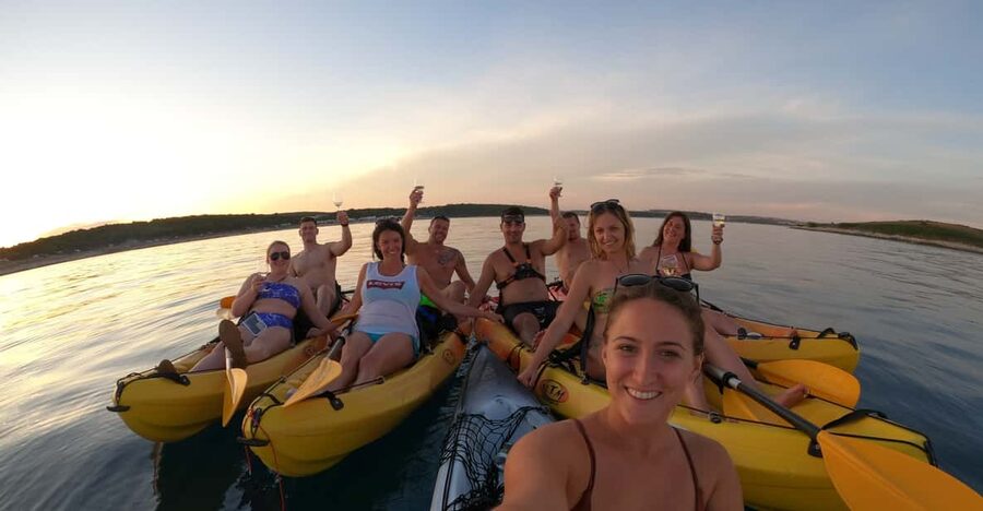 Cape Kamenjak: Sunset Kayak/SUP Wine Tour - Paddling past Trumbuja island