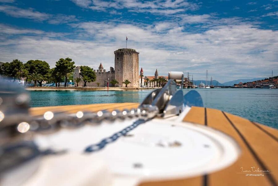 Discover Trogir: Guided Walking Tour of a Medieval Gem - Entering Through the Ancient Town Gate