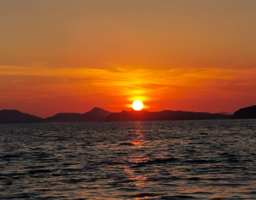 Dubrovnik: Golden Hour Sunset Cruise - The City Walls from a wide angle
