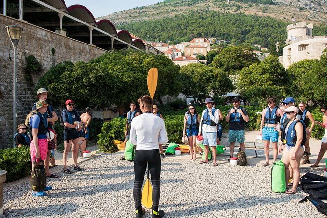 Dubrovnik: Sunset Kayak & Snorkel Tour with Wine & Water - Returning beside the Old Town