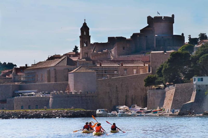 Dubrovnik: Sunset Sea Kayaking Tour - Passing the walls as the light changes