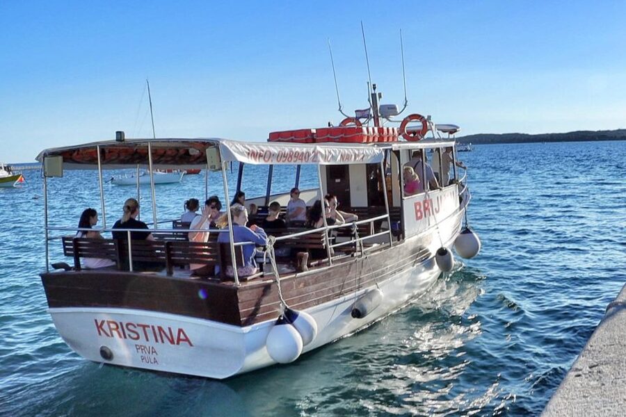 Fazana: Guided Dolphin Watching Sightseeing Cruise at Sunset - Leaving Fazana as the sun begins to drop
