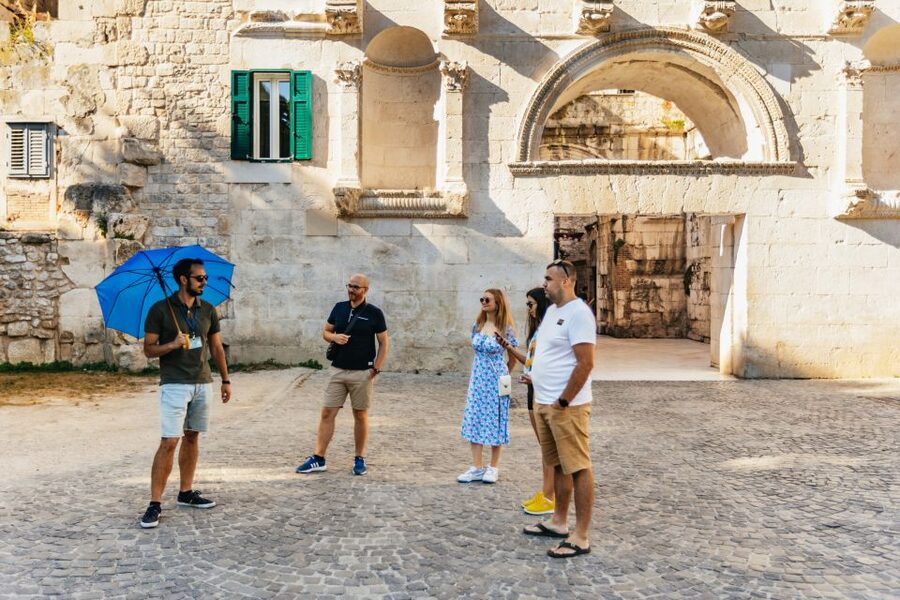 From Split: Half-Day Split & Trogir Small Group Guided Tour - Walking through the Roman palace in Split