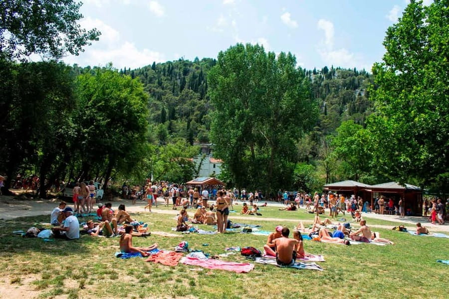 From Split: Krka Waterfalls Tour with Boat Ride & Swimming - Skradin: cobbled streets, lunch, and river time