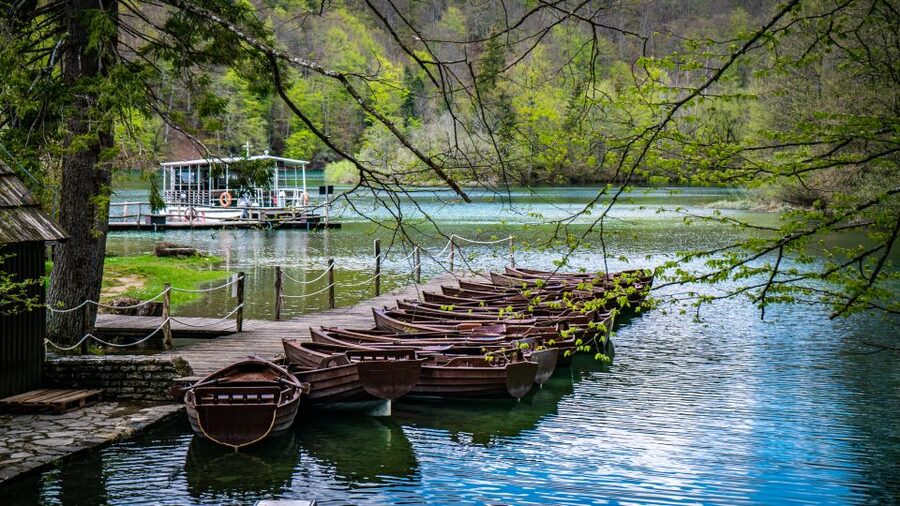 From Split: Plitvice Lakes Guided tour - The boat ride across the clear water