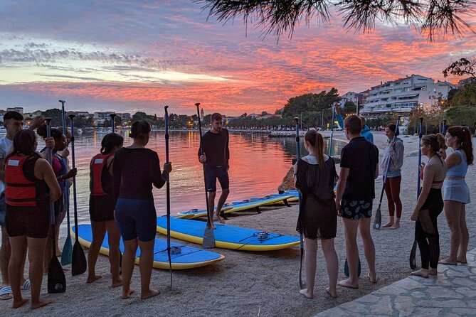 Glowing Stand-Up Paddle Experience in Split - White rocks, cliffs, and traditional houses