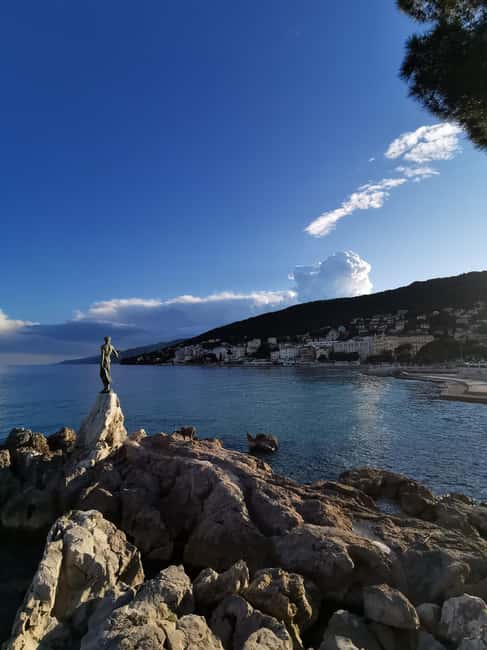 Opatija Be Charmed Half Day Tour with a Local - Walking the Lungomare toward the sea statue