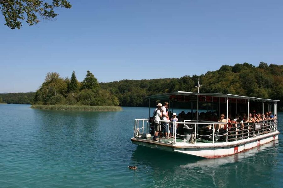 Plitvice Lakes: Guided Walking Tour with Boat Ride - Following the wooden paths through the lower lakes