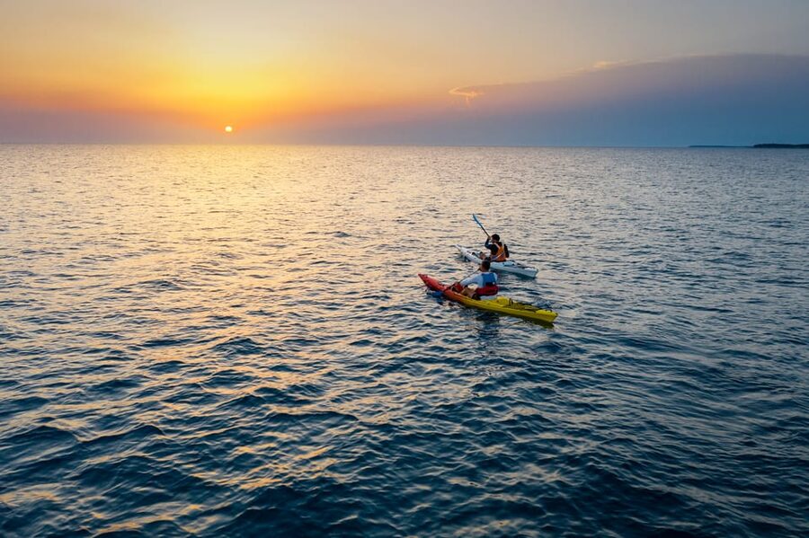 Poreč: Sea Kayaking Sunset Tour - The halfway stop for swimming and snacks