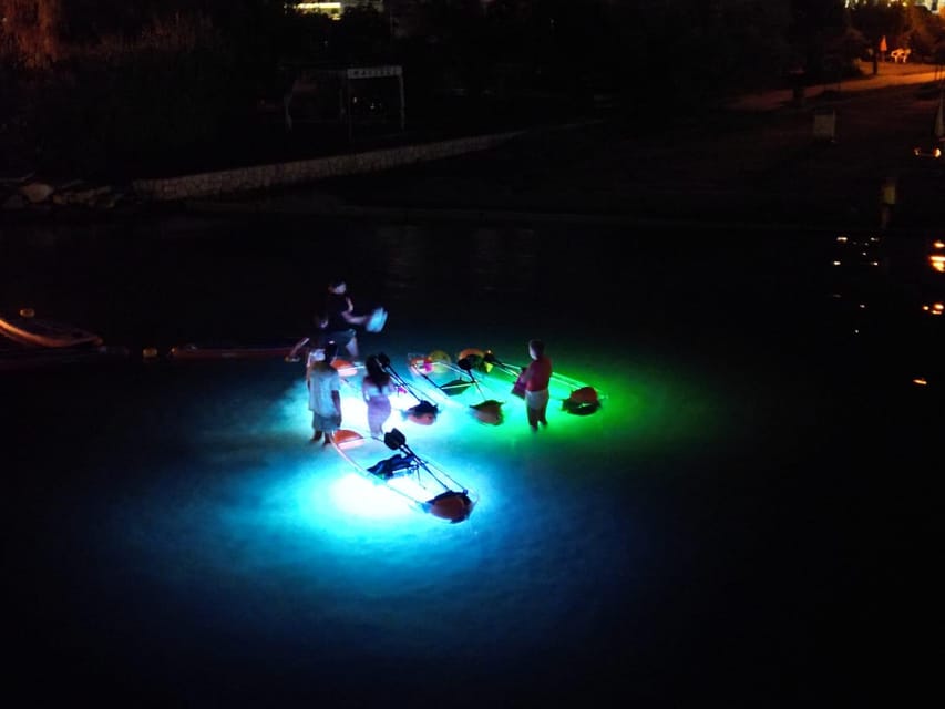 Rab: Night adventures illuminated transparent kayaks - Why night kayaking at Mel Beach feels different