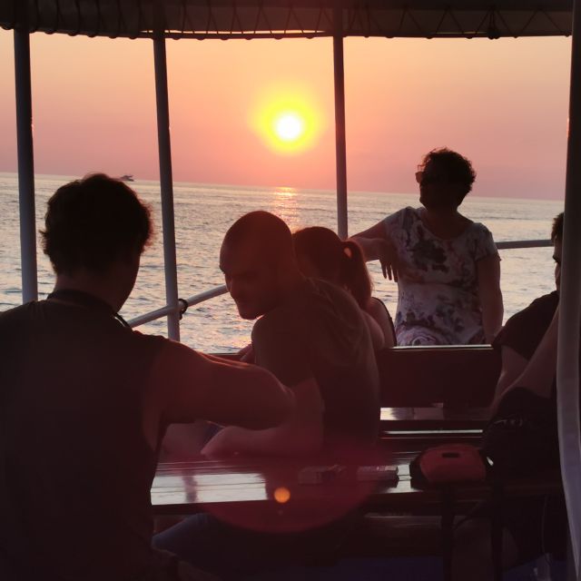 Rovinj: Sunset Boat Trip with Dolphin Watching - Islands, sea air, and the welcome drink