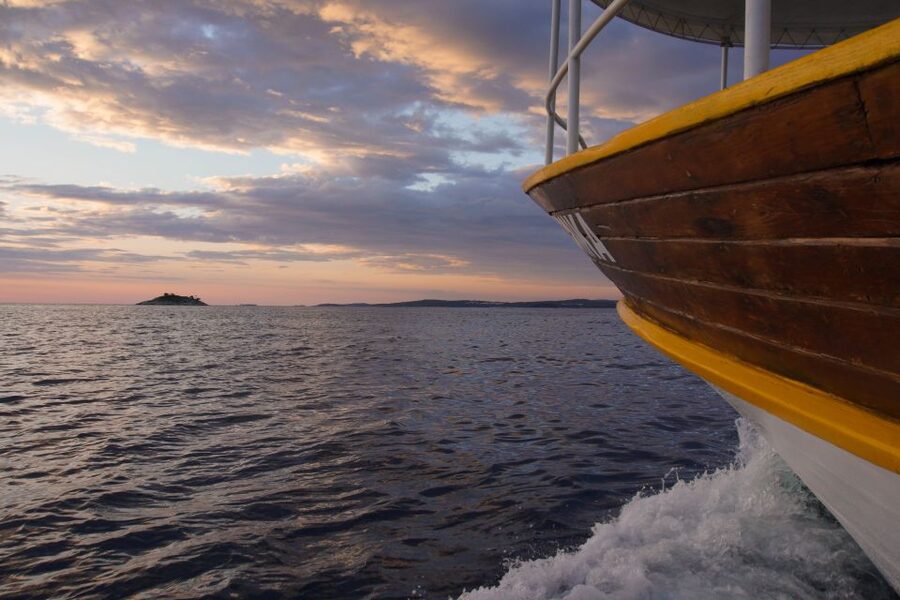 Rovinj: Sunset Boat Trip with Dolphin Watching - Leaving Valdibora and passing Rovinj Island