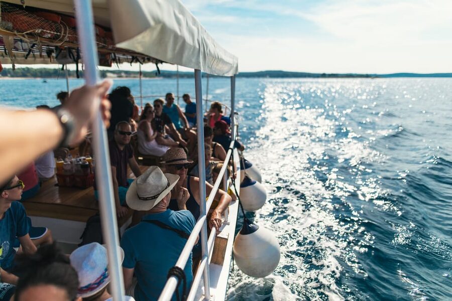 Rovinj: Sunset Cruise with Swim Stop, Drinks, and Fruits - Sunset views of Rovinj from the water