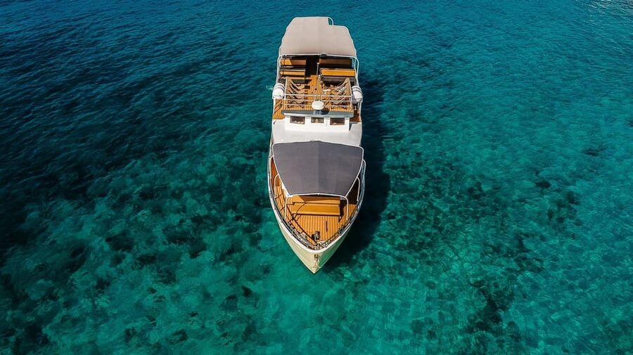 Split: Blue Lagoon and 3 Island Cruise with Food and Drinks - Leaving Split with donuts and a welcome drink