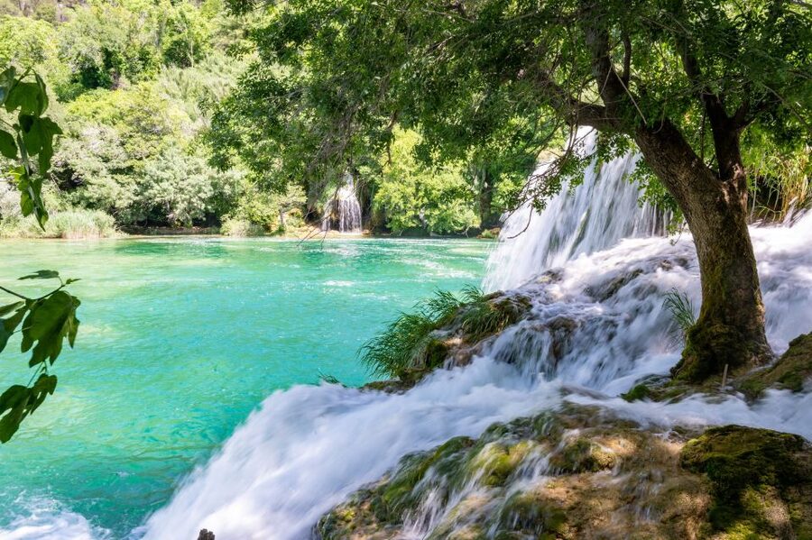 Split: Krka Waterfalls Guided Day Trip with Swim & Boat Tour - Walking through Krka National Park