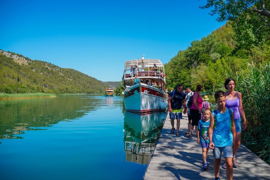 Split: Krka Waterfalls Trip with Boat Cruise and Swimming - The Skradin Boat Ride Sets the Mood