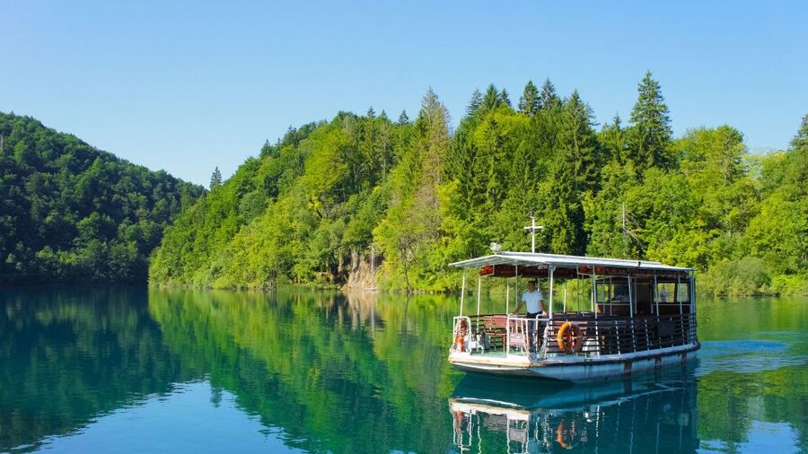 Split: Transfer to Zagreb with Plitvice Lakes Entry Tickets - Boat ride, forest paths, and panoramic train
