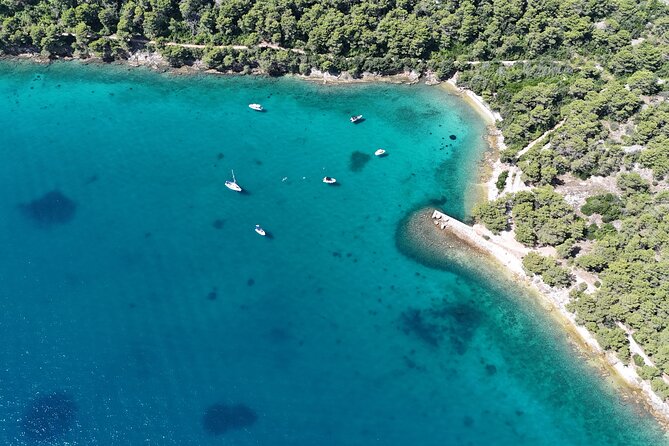 Zadar: Original Island-Hopping Speedboat Tour - Preko: a sandy beach, Galevac, shops, and cafes