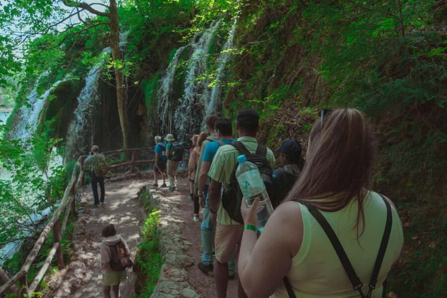 Zadar: Plitvice Lakes Guided Day Tour with Tickets - Walking through the upper and lower lakes